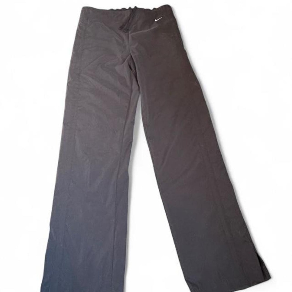 Y2K vintage Nike black track pants with the classic gray tag.